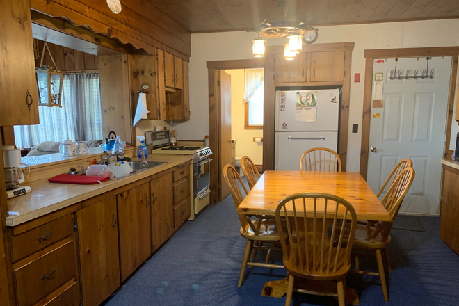 Kitchen and dining area - Waterfront Home. Fully Furnished. All Utilities Included. Direct Ocean Access & Beautiful Sunsets.