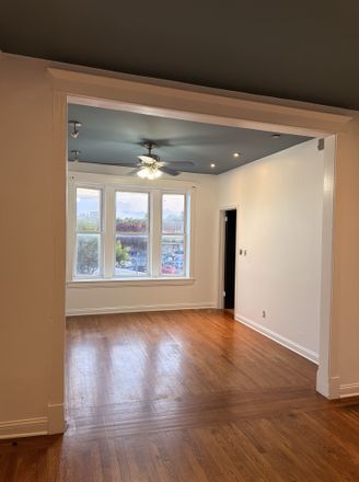Living Room - Spacious Renovated 3BR near UIC · In-Unit Laundry · Steps to Pink Line Apartments