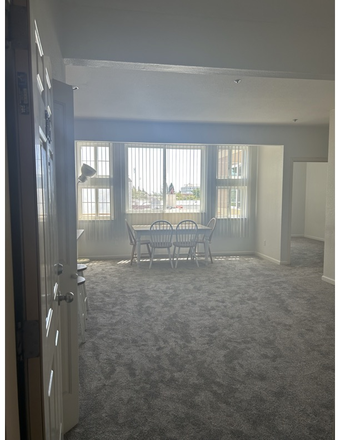 Living Room/Dining Area - Beautiful 3 Bedroom Condo Very Close to Campus