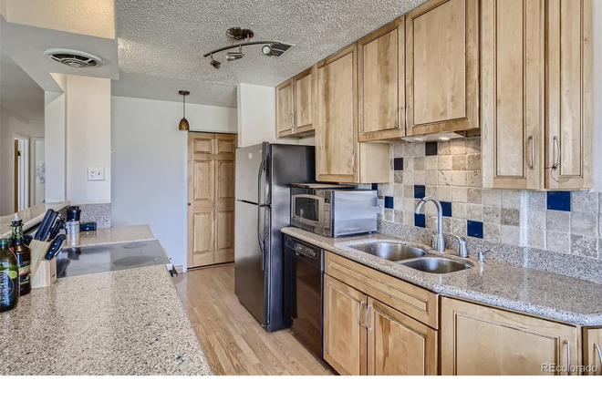 Kitchen with custom cabinets, granite counters and new appliances - Location. Location. Location. 2BD/2BA Corner Condo across from CU. Walk to The Hill & Chautauqua.