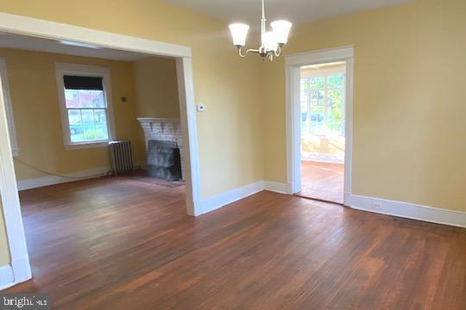 Living room to dining room flow - 4-Bedroom 3-Bathroom Brick Colonial near National Cathedral between American U & Georgetown U House