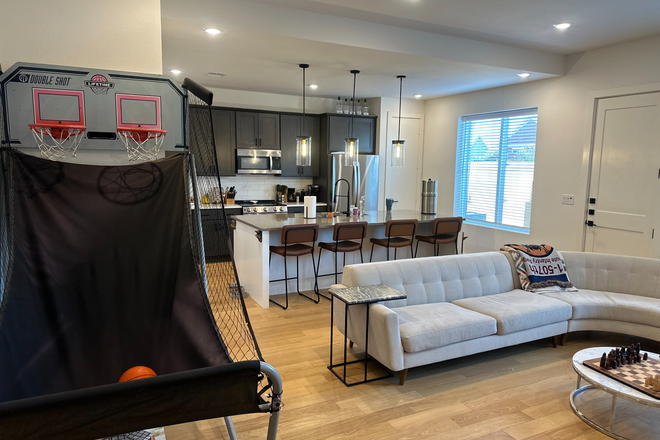 Living room and kitchen - The Urban- Bike to TAMU/Bus Route - New Townhome - 1 Roommate Needed - Utilities Incl.- Garage/Yard