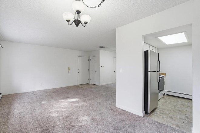 Living Room/Kitchen - Updated 2BR Condo – Walk to CMU – Pool – Available Now