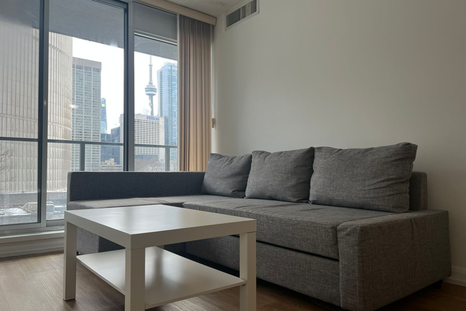 Living room (shared) - 1 furnished room sized den in a furnished 2bathroom 1+1apartment .