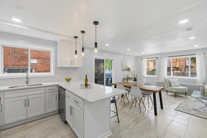 Open concept kitchen, living space, and half bath - ½ Mile to Catholic U | Safe, Renovated 3BR | All Utilities Included | Off-Street Parking