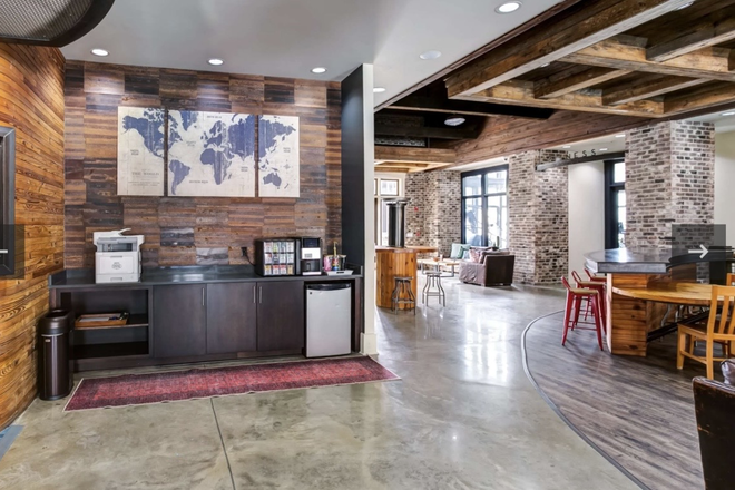 Clubhouse with complimentary coffee bar, free printer, and large hangout spaces - Modern and spacious apartments close to campus!