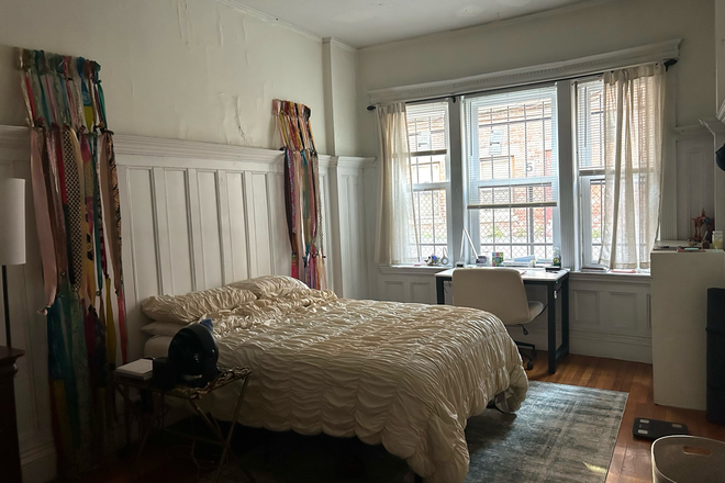 bed with rug and desk by windows - 1-bedroom sublet in 2-bedroom spacious apartment, near green line Riverway stop