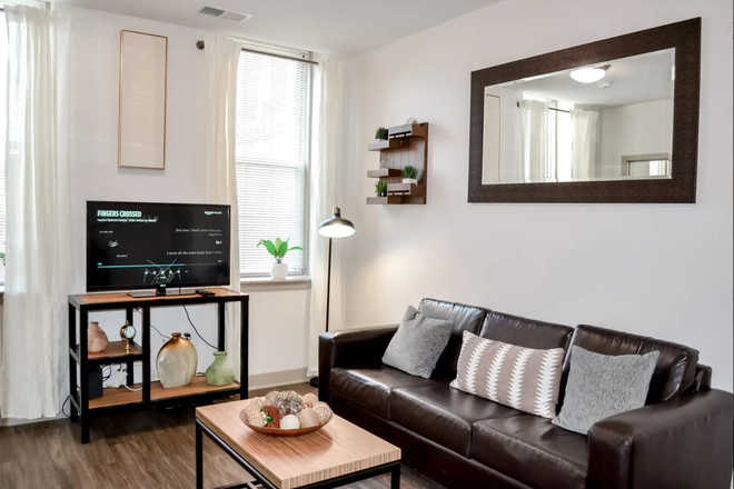 Modern furnished 1BR/1BA with leather sofa, full kitchen, in-unit washer/dryer, high-speed internet, and all utilities included! - JHU Summer Sublet! Luxury High-Floor 1BR/1BA, All-Inclusive & Furnished at The Academy on Charles