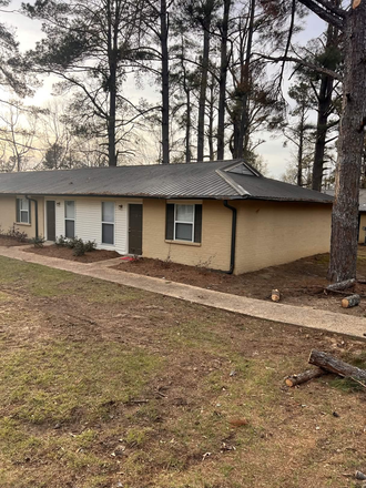 Outdoor picture. Dont mind the logs, theyre leftover from the storm and are being removed soon. - 1 Roomate Needed for Pinegrove Apartment