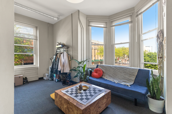 Living room w floor to ceiling windows - Apt. A. Double Bay Windowed, Spacious & Affordable 2 Bedroom Apartment