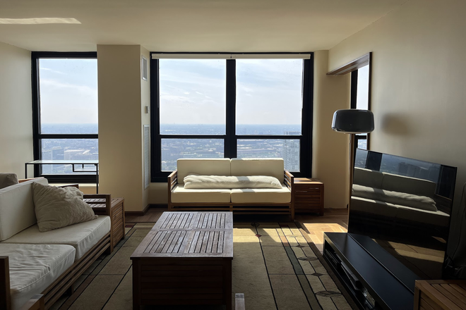 Living Room - Stunning 50th Fl. Views with Curated Design – Perfect for Academics & Supercommuters