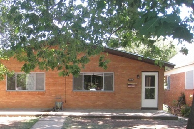 Front of house. - Large home one block from campus