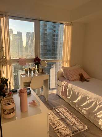 Bedroom - 1 Furnished Bedroom in a Southwest facing, 3-bed 2-bath Corner Apartment with In-suite Laundry.