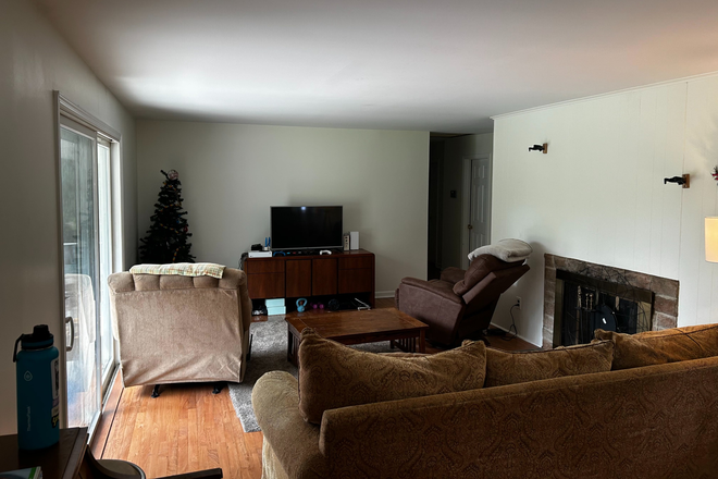 Furnished living room w/ comfy chairs & couches, coffee table, and TV. - Sublet:Room in shared 3BR home-Edgemere Ave-Plainsboro