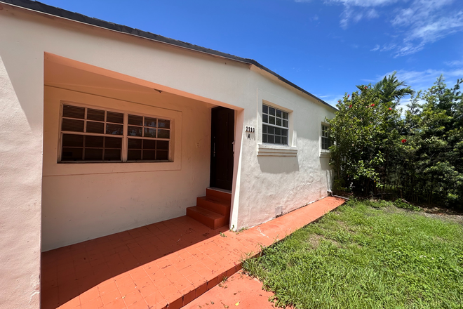 Covered front entrance and view of the lovely private yard - Cozy and walk-able 2-bedroom house