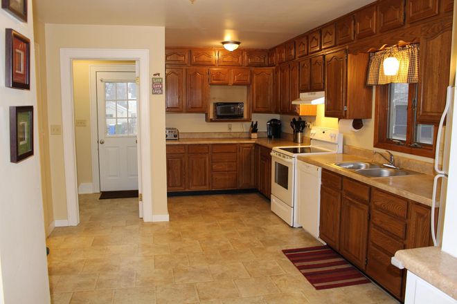 Main level kitchen with dishwasher - Room for Rent (laundry, garage & garden space, off-street parking, internet/gas included)
