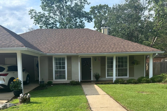 Front of the house with a 2 car carport - 3 Bedroom House in Search of a Roommate!