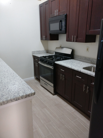 Kitchen A2 - Large One Bed Apt. (Central Air + High Ceiling) with On-site Laundry