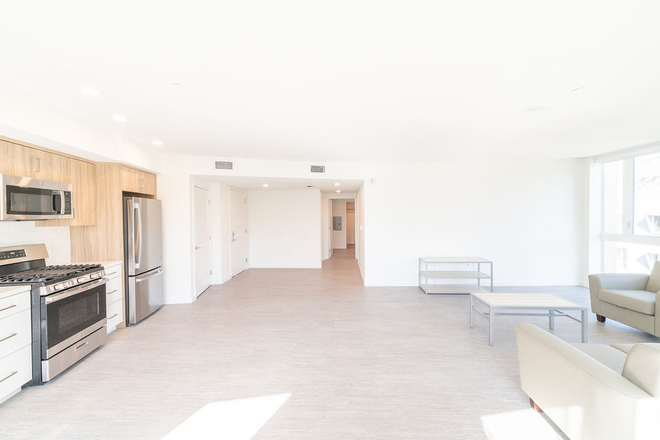 kitchen/living space - Bed in Modern 2BR/2BA at the Kittredge! | Female Only Summer Sublet | W/D + Full Kitchen