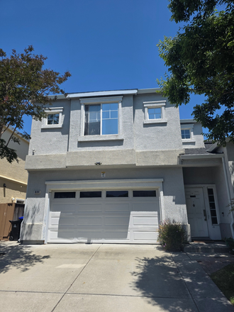 Front of the house. Rental unit is in front of the house above the garage. - Private room in shared property
