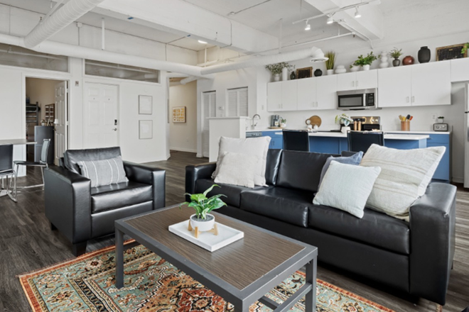 Living room and kitchen - Ramz Lofts at Capital Garage