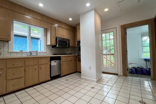 pre-renovated kitchen - Near Medford Campus House