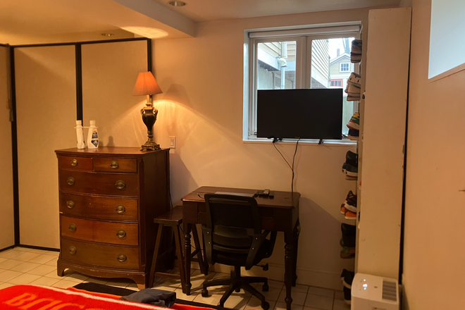 Bedroom with TV - Huron Ave. with View of Fresh Pond Reservation