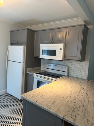 View of Kitchen island from dining room - Quiet Home within walking distance to the U of M and the Highland Strip
