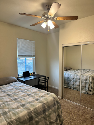 Bedroom - Full size bed, ceiling fan, desk, chair, and closet - Alight West Lafayette