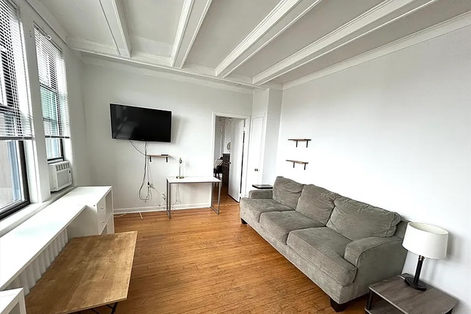 partially furnished - Top floor 1-bedroom apartment with heat and hot water included.