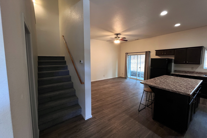 Kitchen/ stairs leading up to bedrooms - Quiet 4-bedroom townhome near NAU with private entry and dedicated parking