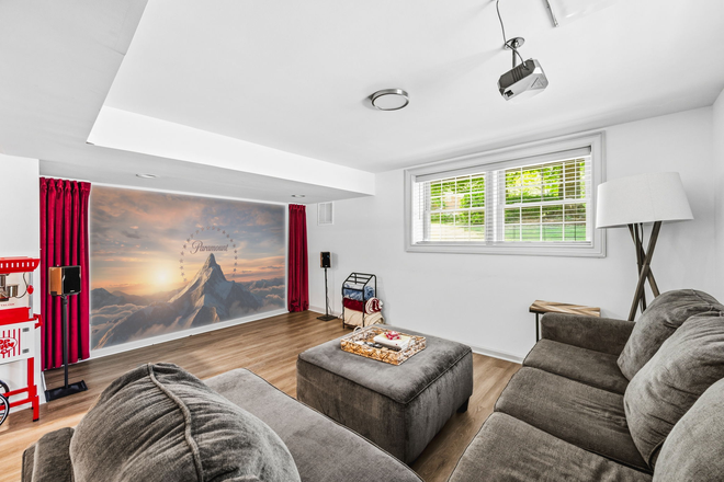 Living Room - Home Theatre with surround sound - Fully Furnished, Private 2BR/1BA Basement Apartment with Home Theatre, kitchenette, shaded patio
