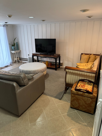 Living room with private entrance (Not Shared) - Private 1BR suite w/ private entrance + bath + kitchenette — steps to MSU & Montclair Heights train
