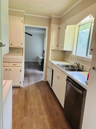 To your left when you walk in the carport door; laundry is on the right - 4BR/2Ba in Great Neighborhood, Convenient to Everything! House