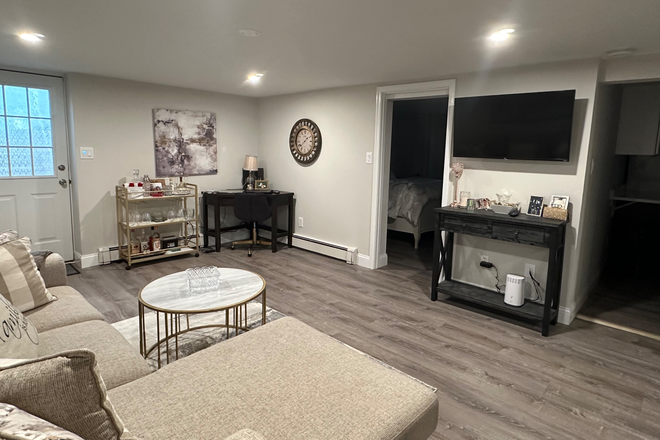 Living room - Available Soon: Renovated 1-Bedroom Basement Apartment Near Stony Brook – Utilities Included!