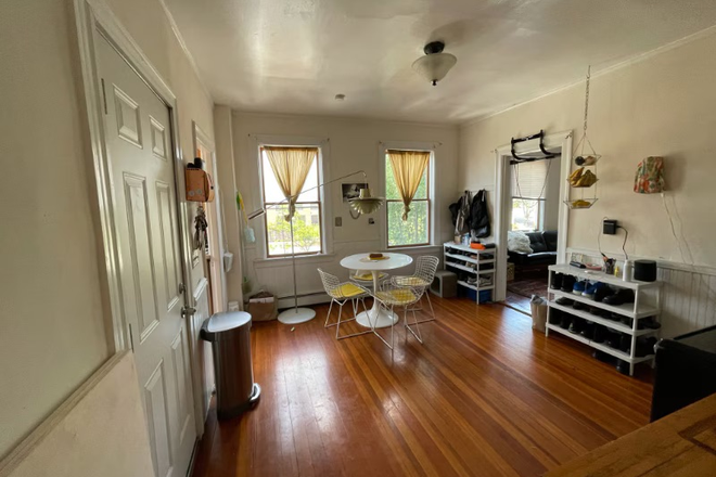 Kitchen / Dining Room with door to side stairwell. Refrigerator is next to the stove but out of frame in photos. - Spacious 2nd floor Apartment in the Heart of Providence.