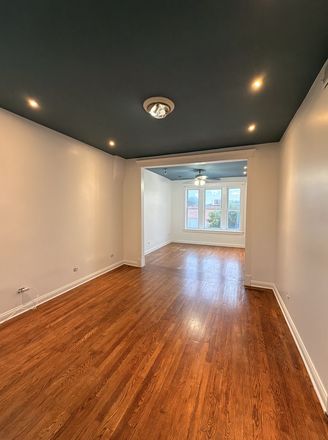 Living Room - Spacious Renovated 3BR near UIC · In-Unit Laundry · Steps to Pink Line