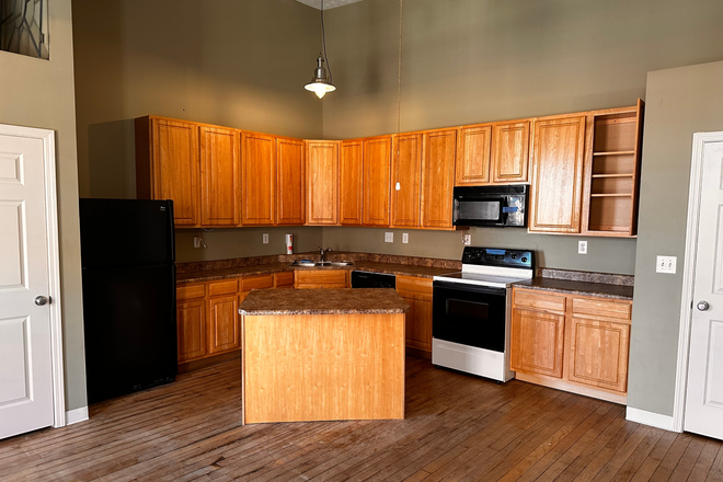 View of kitchen from living room - Downtown Lafayette Condo with High Ceilings and a Walkable Neighborhood