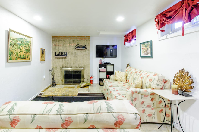 Fireplace and family room - Duplex Basement Apartment w/ own entrance and ALL UTILITIES INCLUDED AND Free Parking