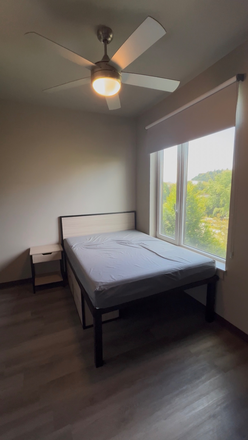 Bedroom with bed-side table, clothing droors underneath bed, and space for storage underneath bed - The Standard Apartments
