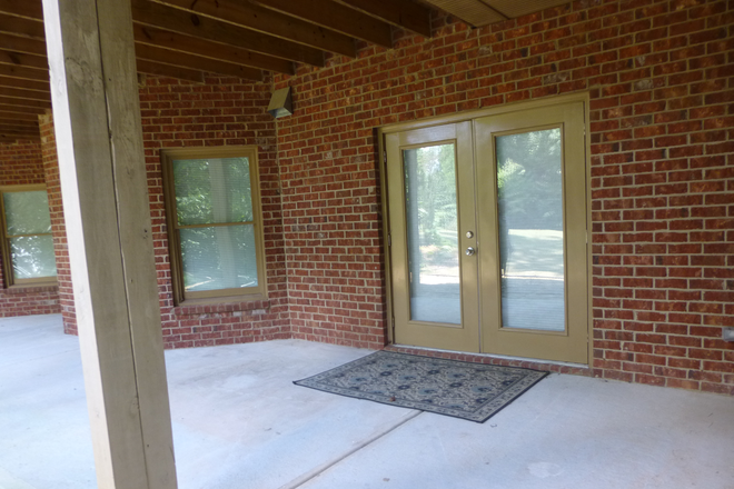 Front door and patio. - Quiet 2- Bedroom Apartment 4 miles from Emory