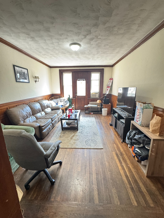 spacious living room with private deck - 2 bed/ 1 bath at 2013 Commonwealth Ave. Heat & Hot water included. Apartments