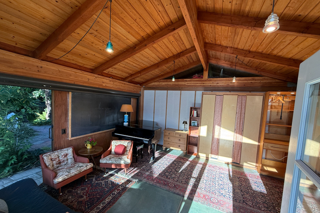 Murphy bed "up" in wall, Barn Door sliding wall open - Quiet Garden Cottage; Walk to UC