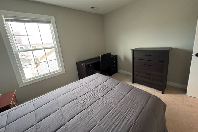 different perspective of bedroom - Room for rent in New Town, close to campus and stores Townhome
