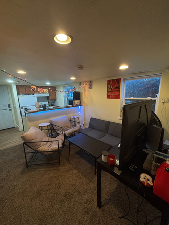 Living room and kitchen from hallway. - Come Live in the "Yellow Sub"! Roommate Needed!