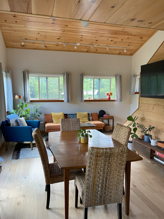 main floor open living/dining/kitchen - Gorgeous modern house in the woods available now / Spring semester (rent includes utilities)