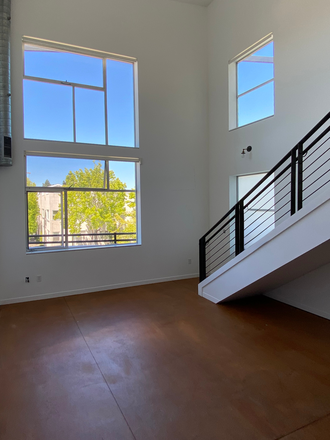 first floor: living room, west- and north-facing window - 1186 Sq feet Loft Apartment with Balcony