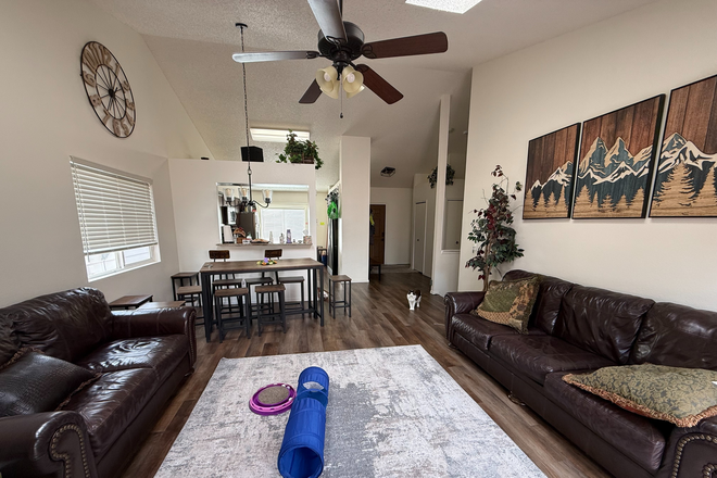 Living Room and Dining Room - Roommate Needed to Share AWESOME 5-BR/3 BA House. Utilities included!