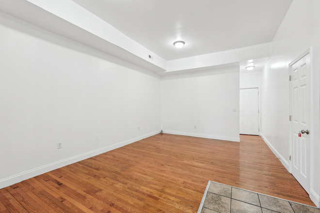 Living Room/Dining Room - Luxury, Pet-Friendly 1B/1B Apartment Available Near JHU Shuttle Stop & Penn Station