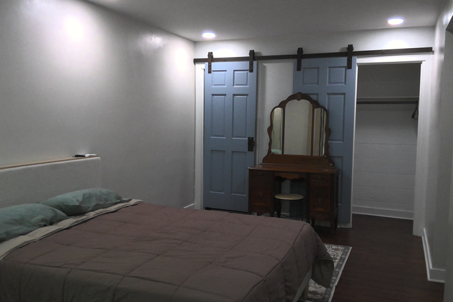 Bedroom looking right - Easy walk or bike to campus. Quiet woodland view.